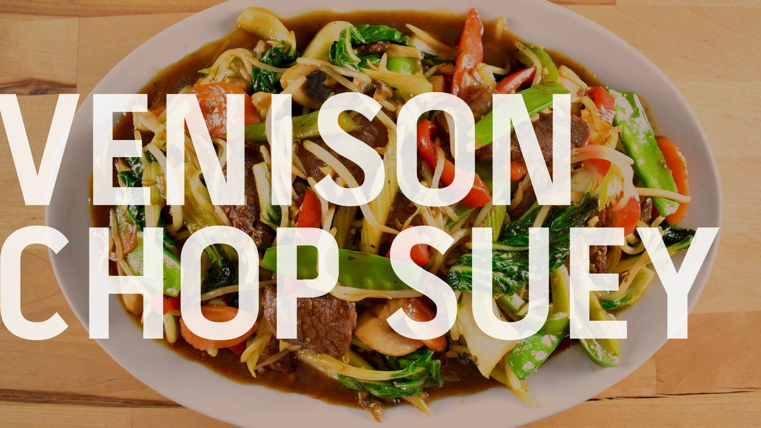 A bowl of venison chop suey filled with meat and vegetables, served over rice