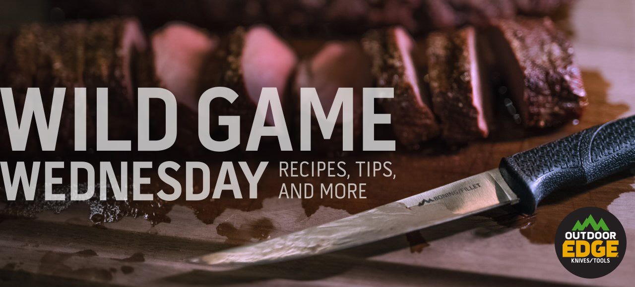 A promotional banner for "Wild Game Wednesday" showing a close-up of an Outdoor Edge knife resting on a cutting board next to slices of cooked wild game