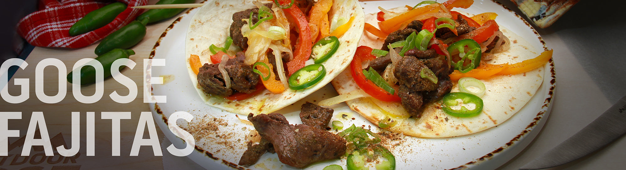 A recipe banner for "Goose Fajitas" showing two finished fajitas on a plate