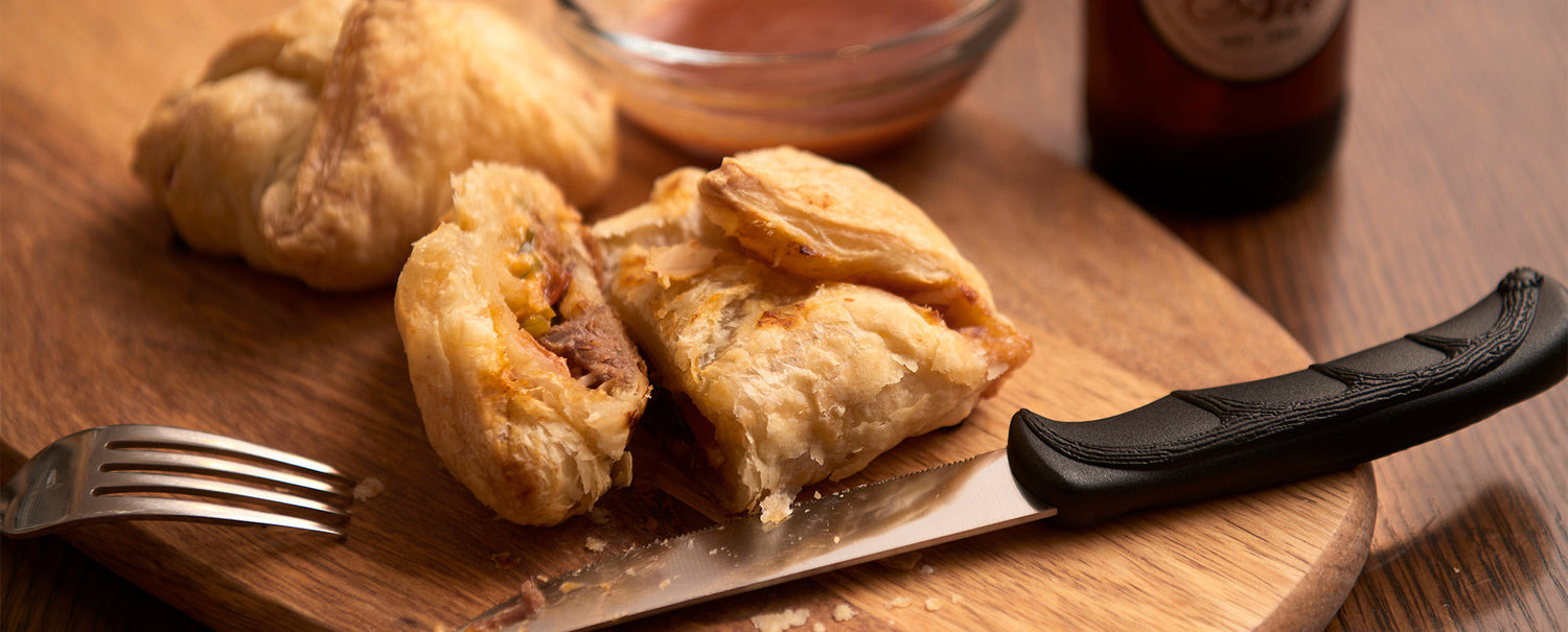 A recipe banner for "Venison Shank Pockets" showing the finished pastries on a plate