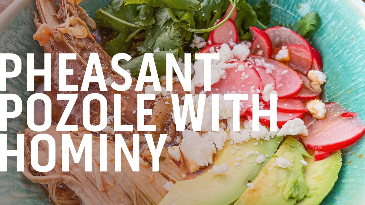 A bowl of pheasant pozole with hominy, a traditional Mexican soup