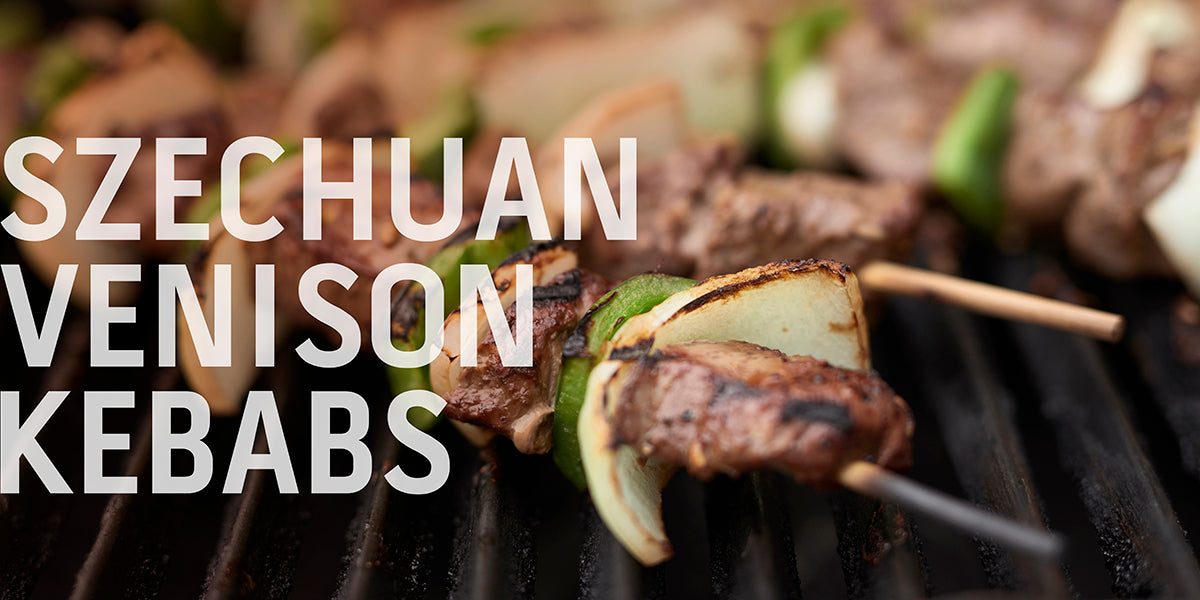 A recipe banner for "Szechuan Venison Kebabs" showing two skewers of grilled meat and vegetables