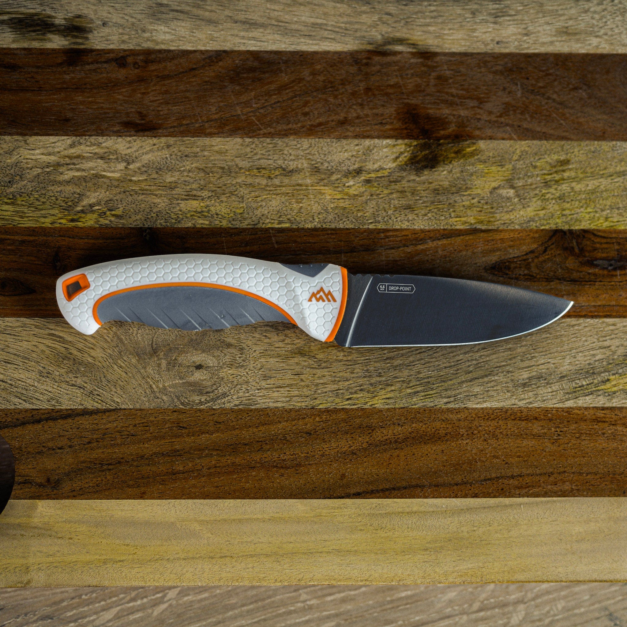 Knife with a textured handle on a wooden surface