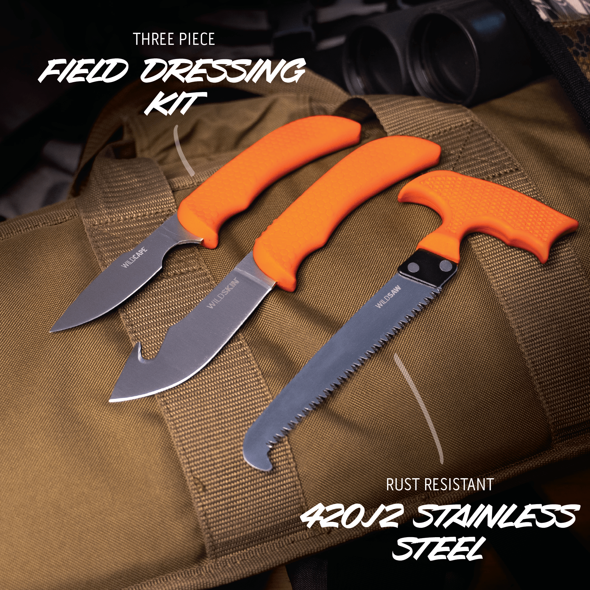 Three-piece field dressing kit with orange handles on a brown bag, featuring text about rust resistance and stainless steel.