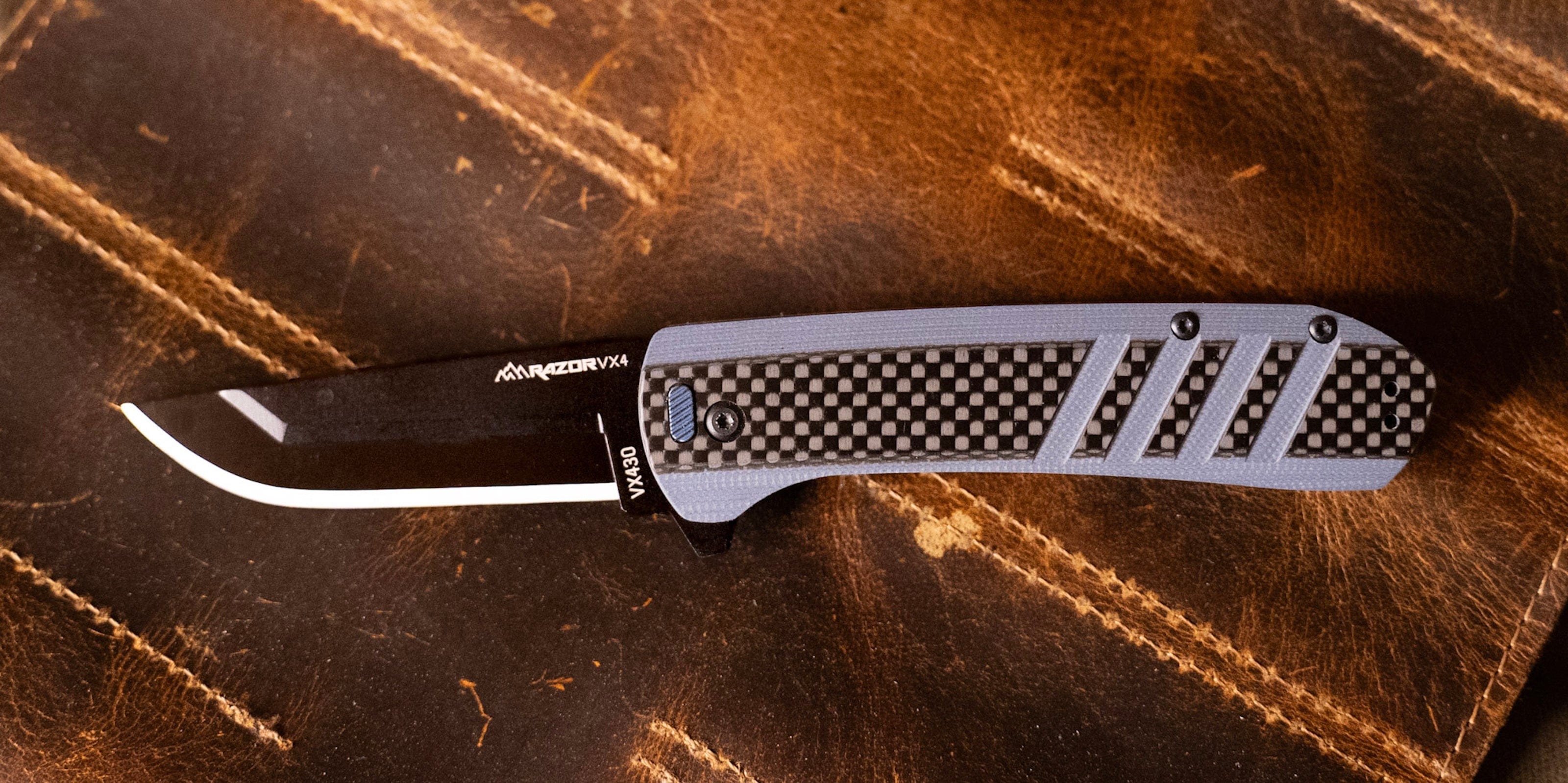 The Razor-VX4 folding knife with a blue G10 and carbon fiber handle and cleaver-style blade