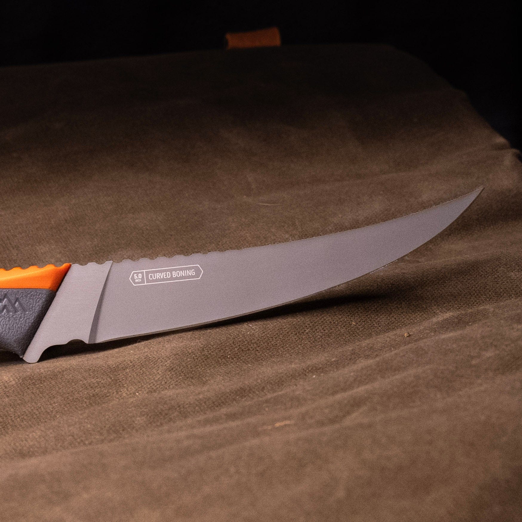 The Vantex boning knife with its orange and grey handle