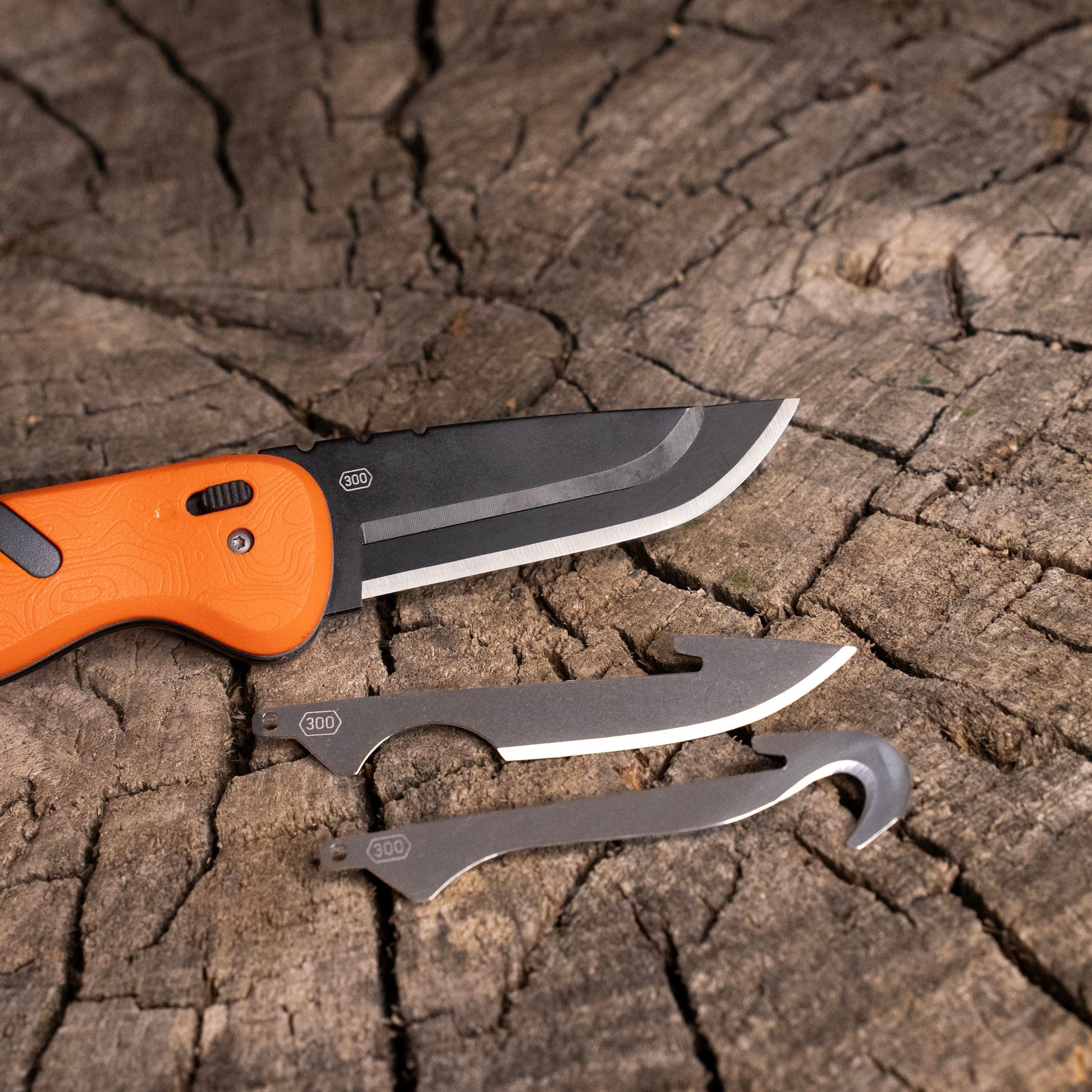 The 3.0-inch Razor-HTX fixed blade knife being used to make wood shavings for a fire