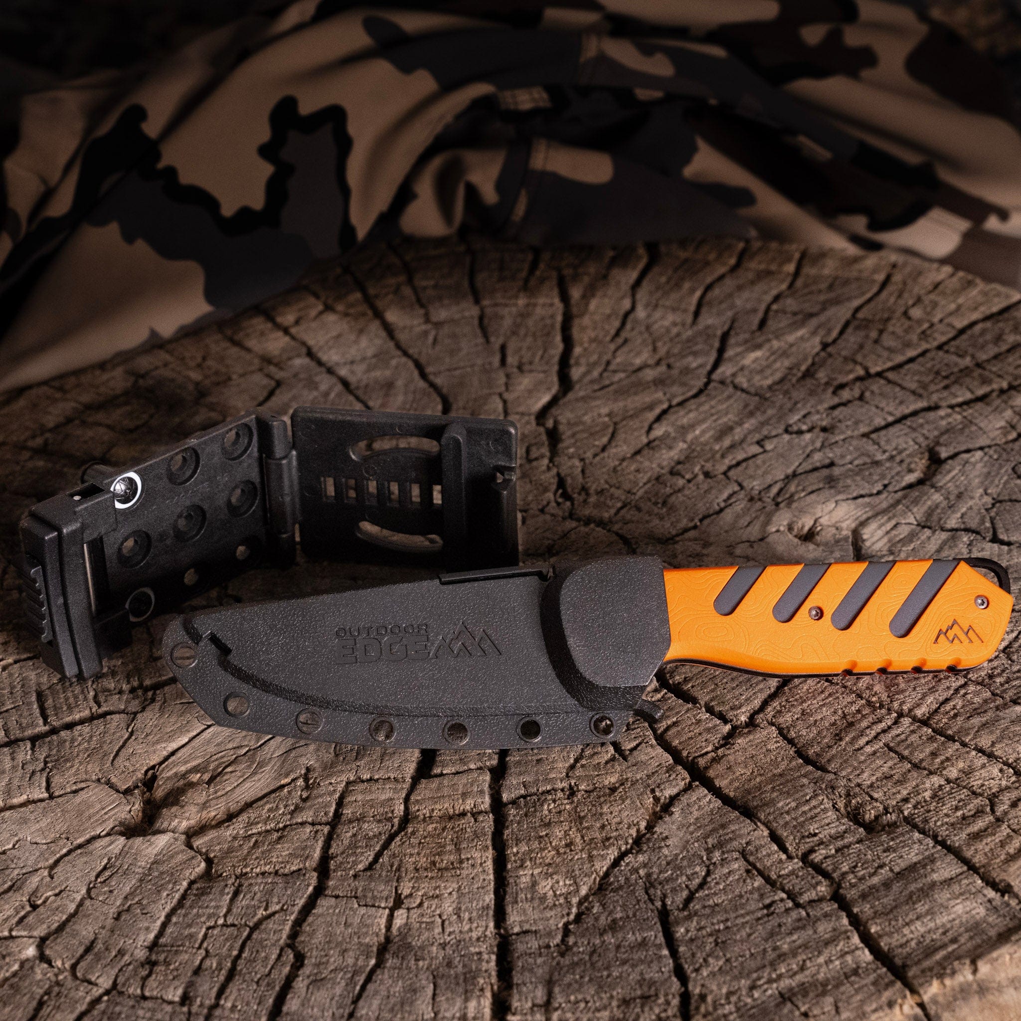 The 3.5-inch Razor-HTX fixed blade knife shown with its sheath