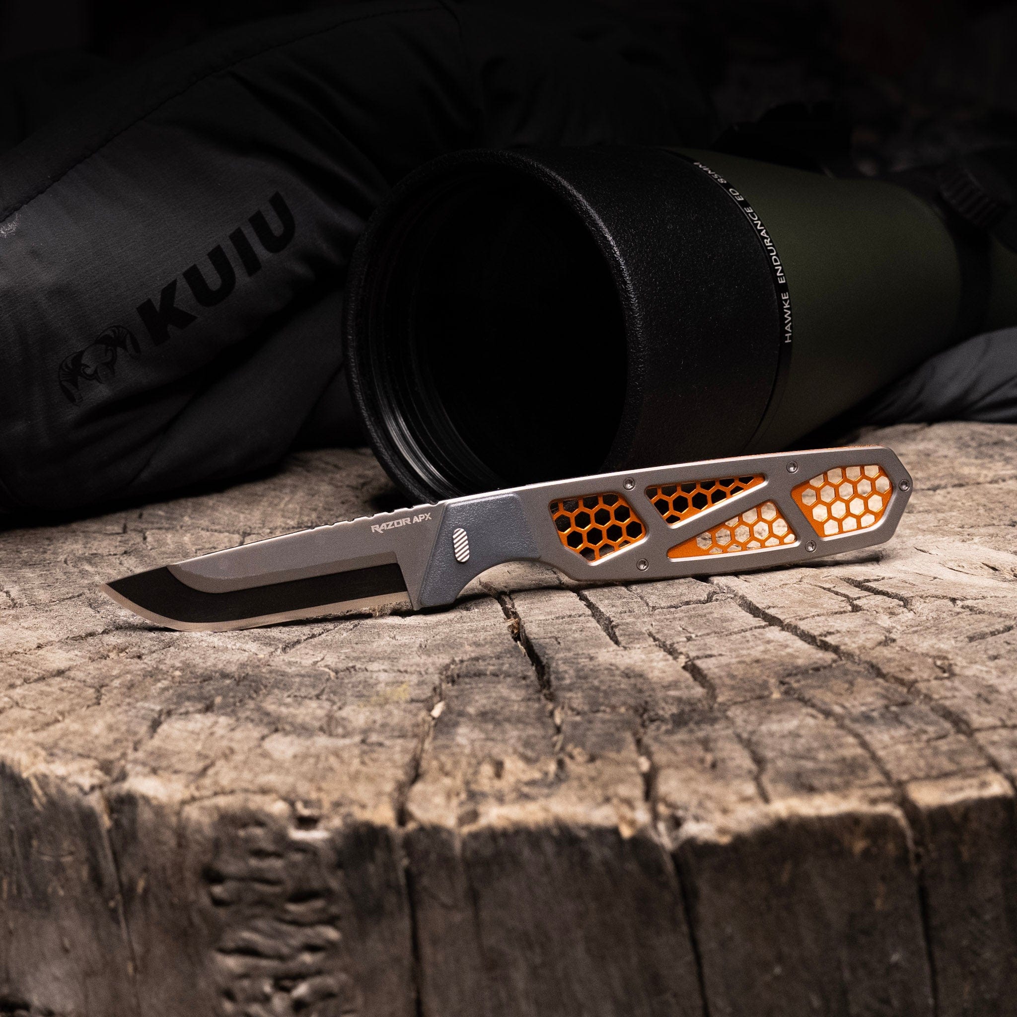 The 3.0-inch Razor-APX knife with a skeletonized orange and grey handle