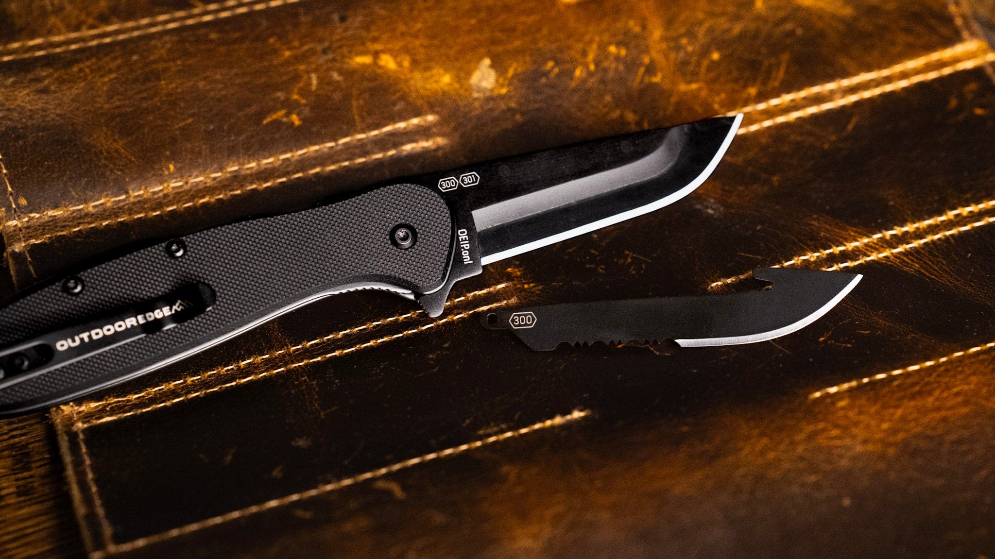 The Razor-VX2 folding knife with a black G10 handle and drop-point blade