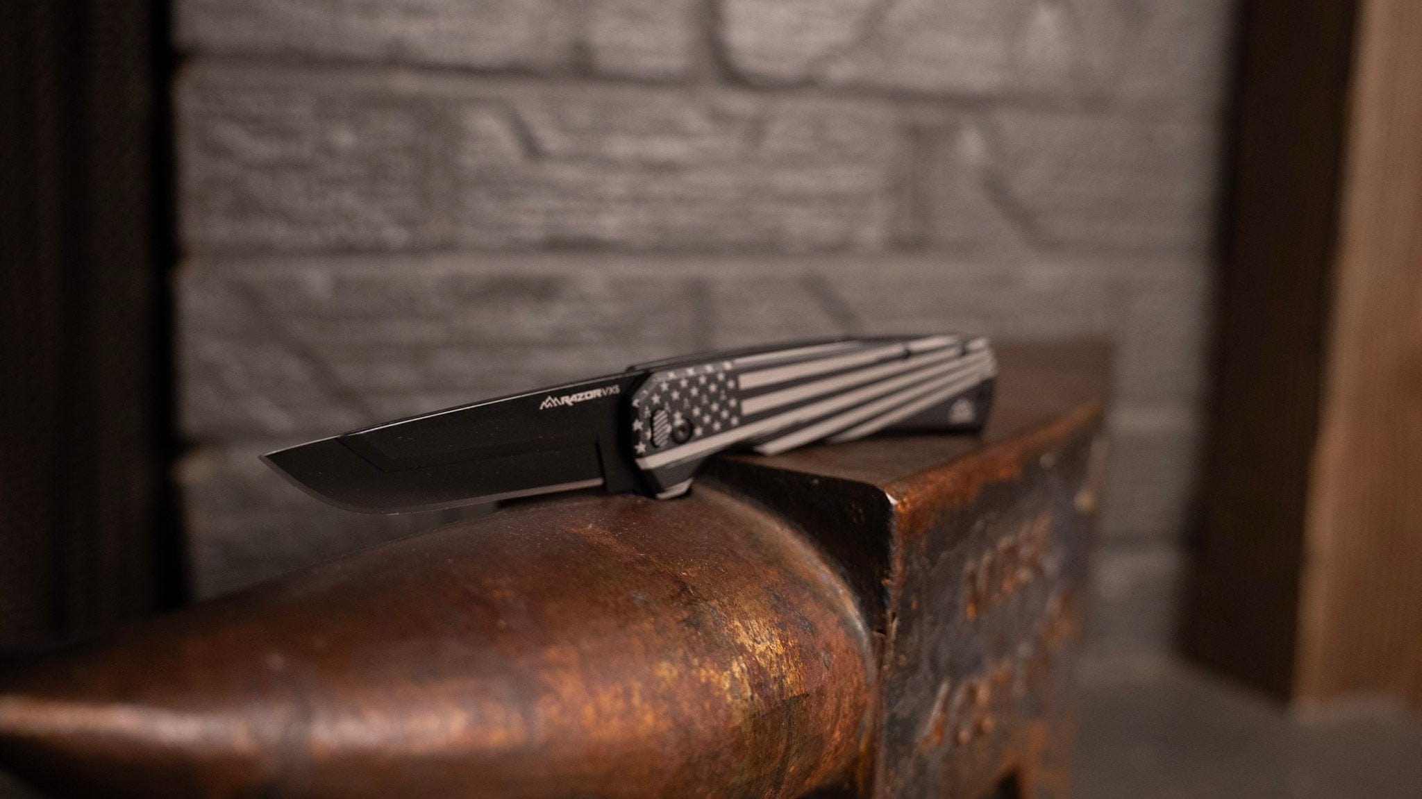A limited edition Razor-VX5 folding knife with an American flag design on the handle