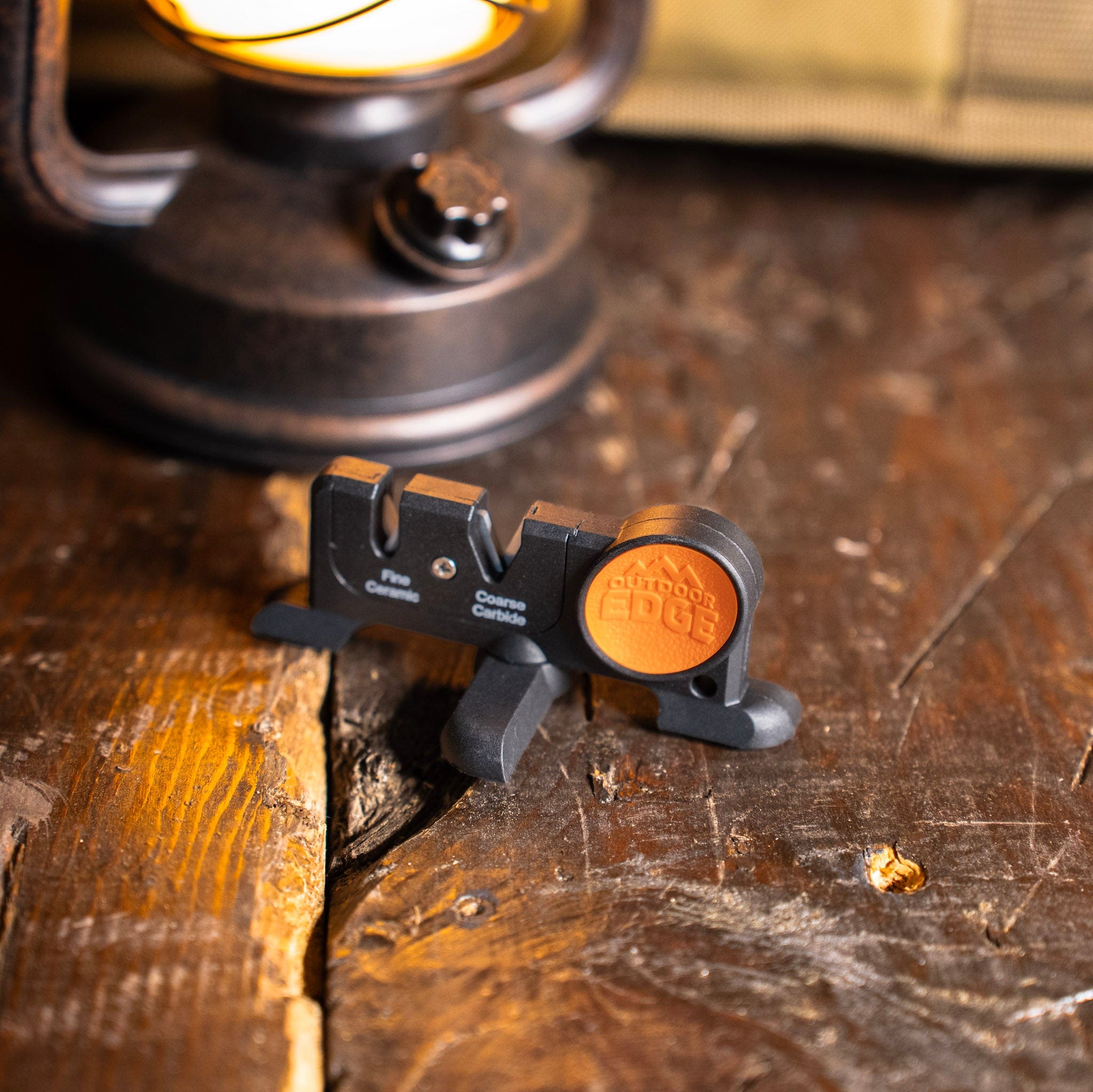 Knife sharpener sitting on a wood table