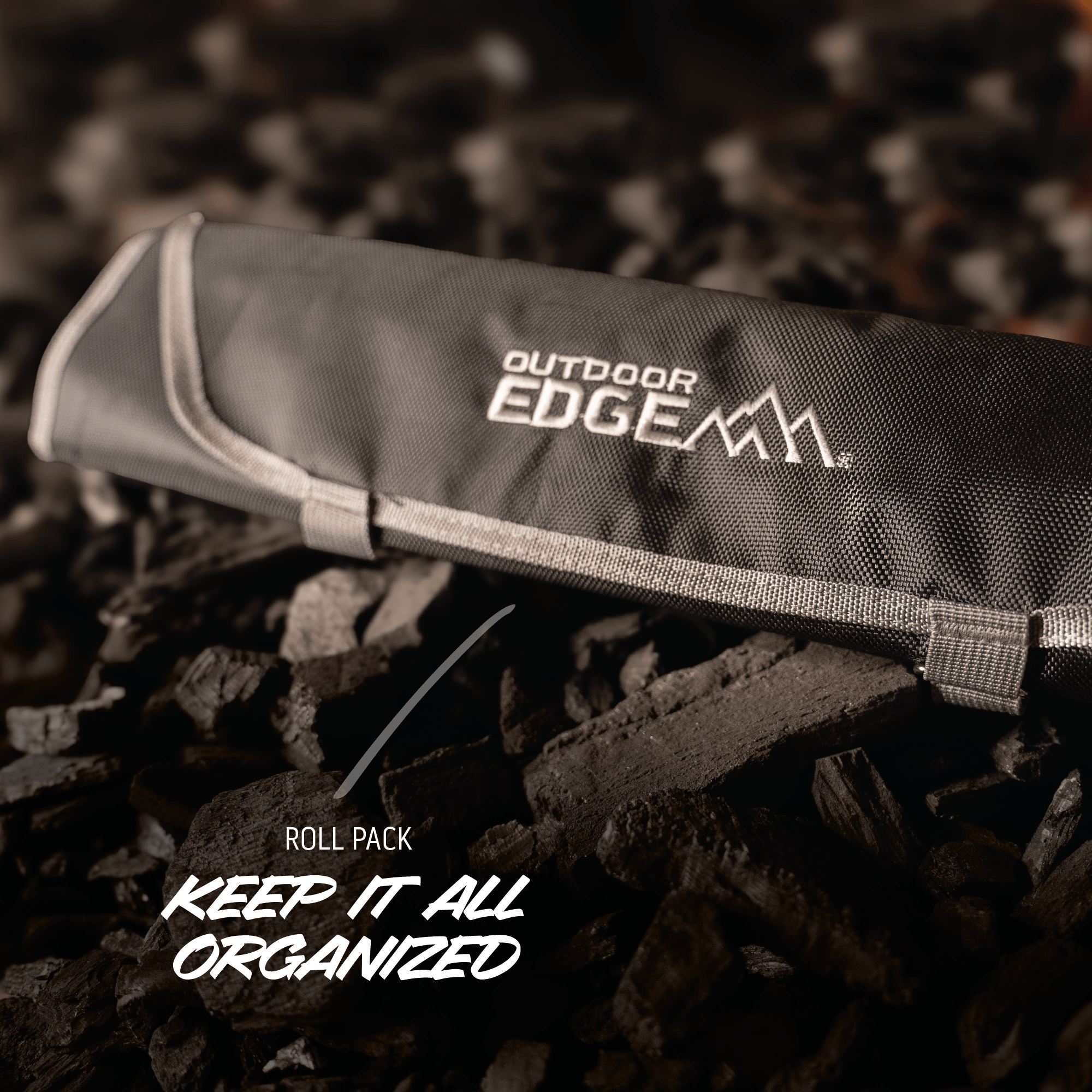Outdoor Edge roll pack on a rocky surface with text 'Keep it all organized'.