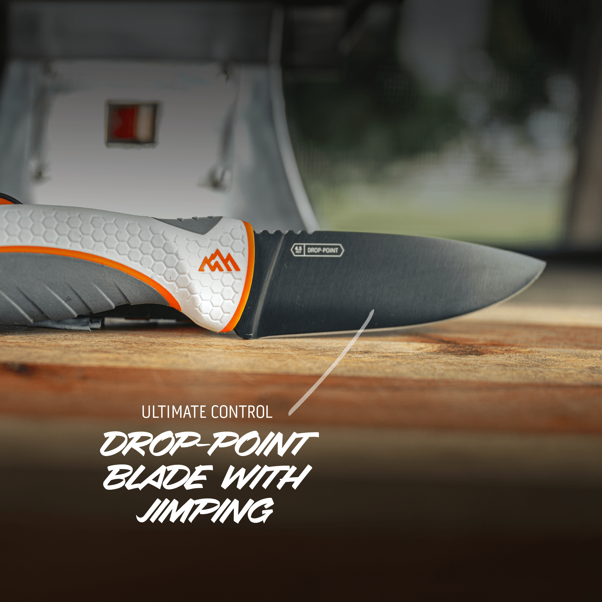 Knife with a drop-point blade and jimping on a wooden surface, with text 'Ultimate Control' and 'Drop-Point Blade with Jimping'.