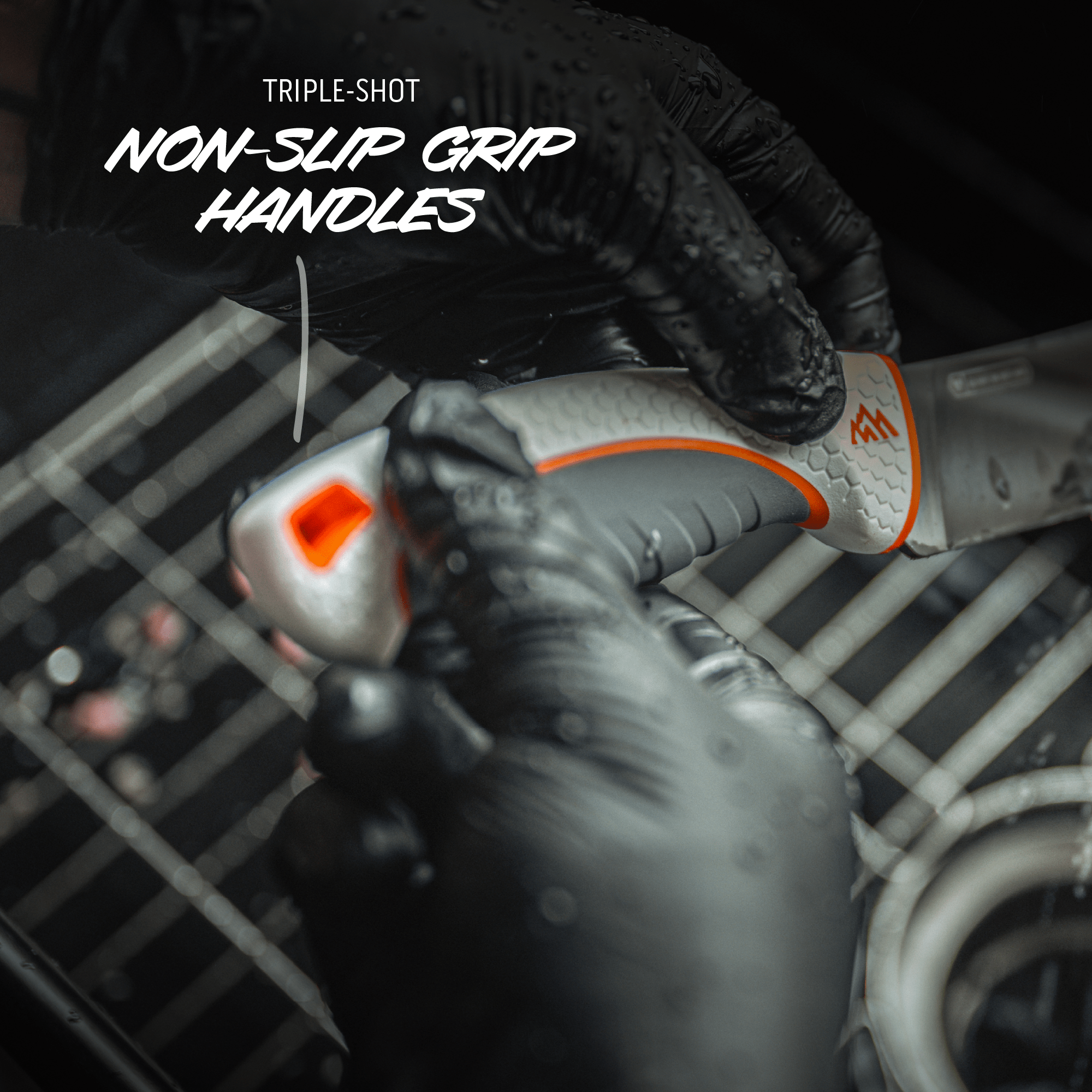 Person wearing black gloves holding a tool with non-slip grip handles, text 'TRIPLE-SHOT NON-SLIP GRIP HANDLES' above.