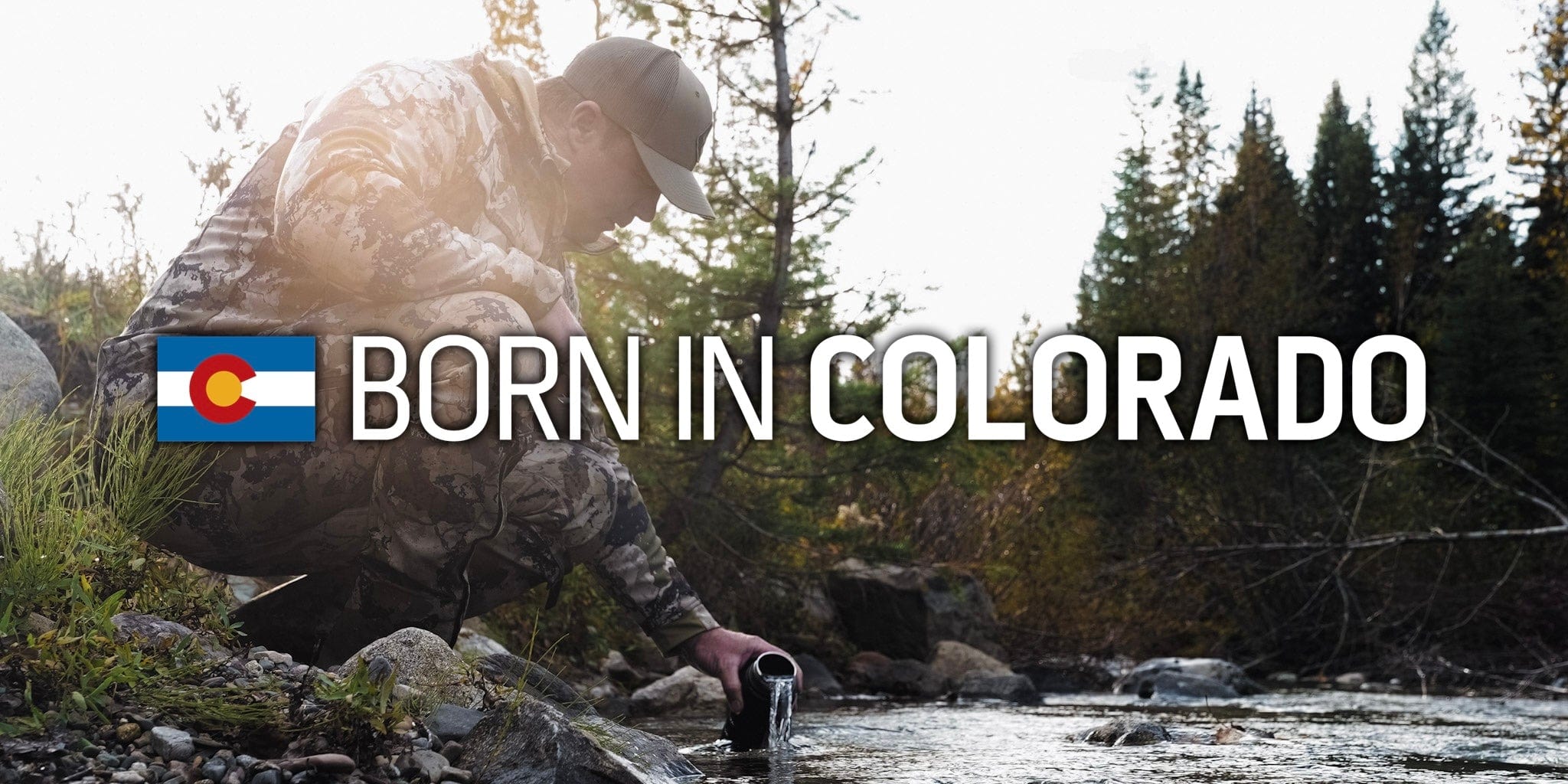 "A hunter in camouflage kneels by a stream to fill a water bottle in a forest, with the Colorado flag and text 'BORN IN COLORADO' overlaid."