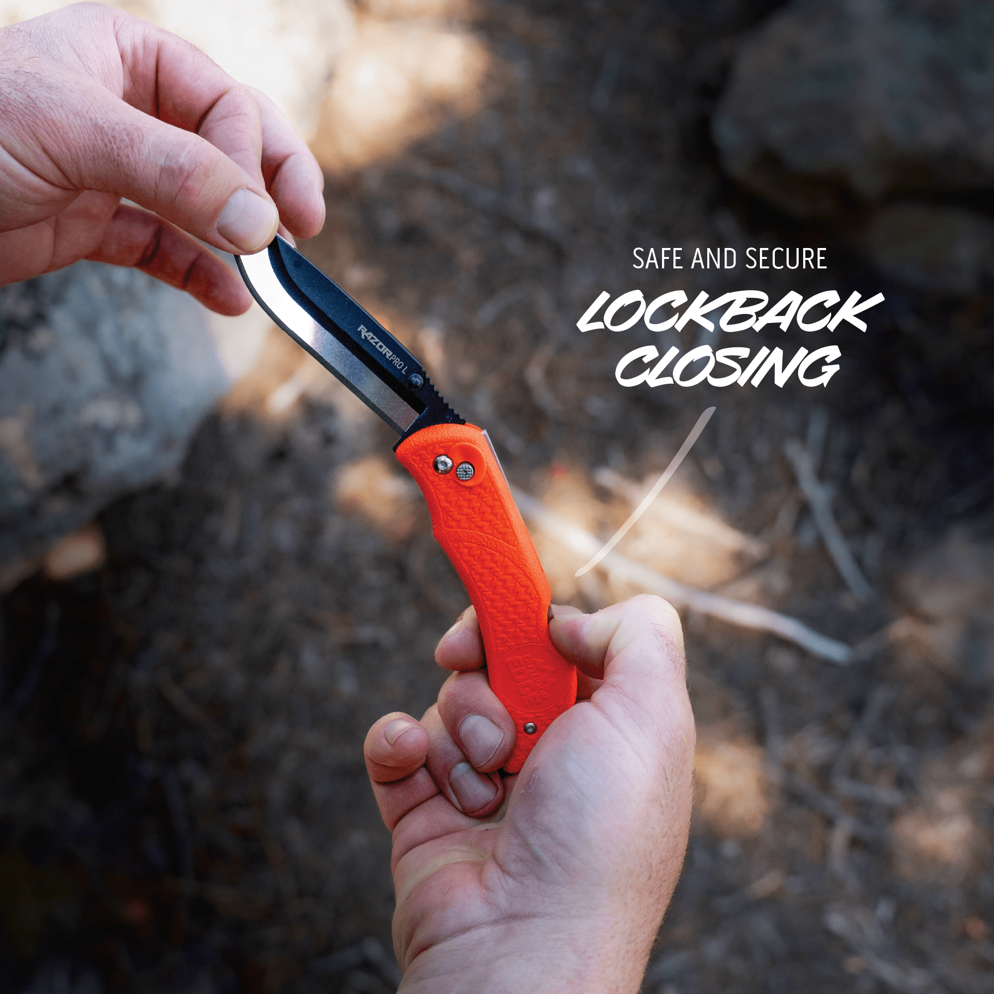 Person holding a folding knife with an orange handle and lockback mechanism, set against a natural background.