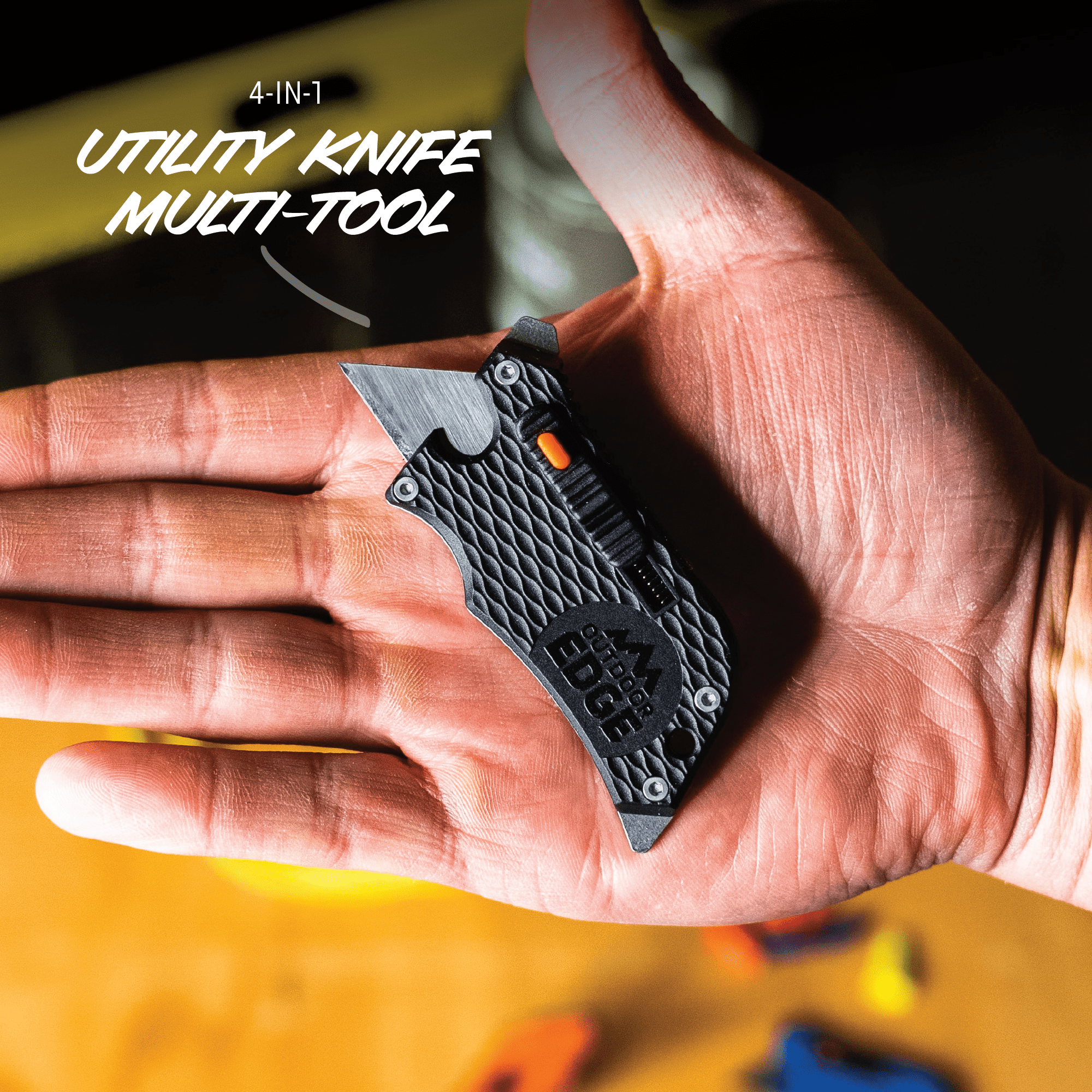 Utility knife multi-tool held in a hand with blurred background