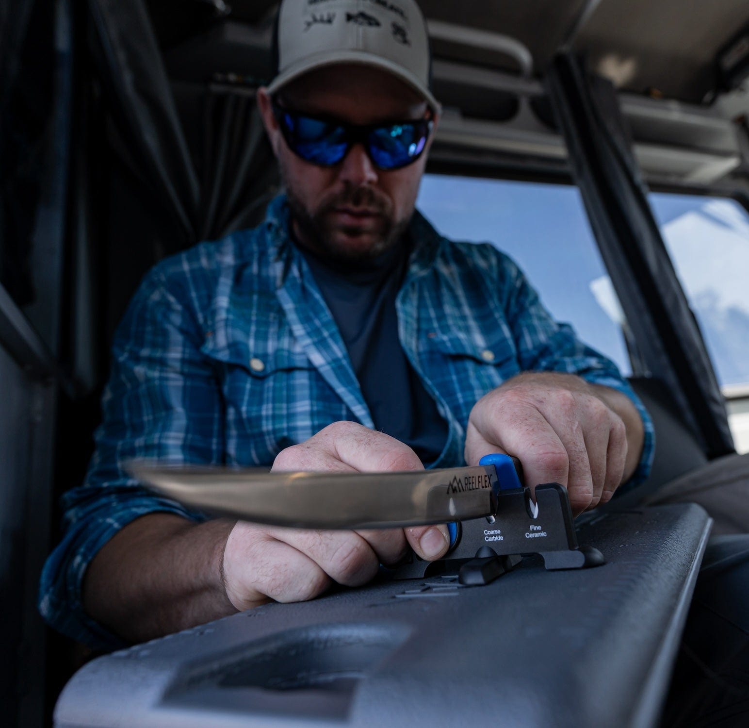 A person holding a freshly caught salmon with a ReelFlex fillet knife