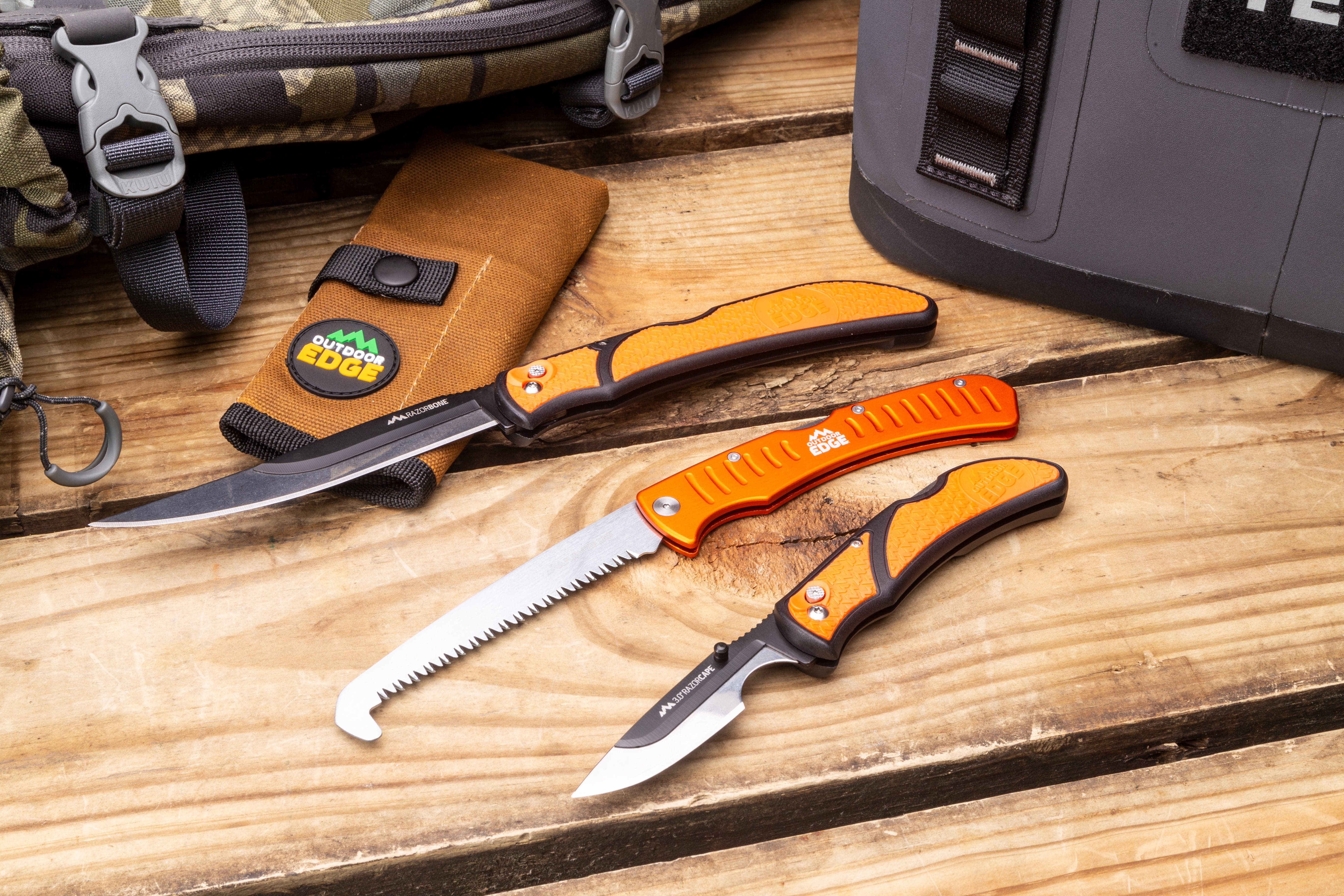 A close-up of the two knives included in the RazorGuide Pak, a replaceable blade folder and a fixed blade gutting too
