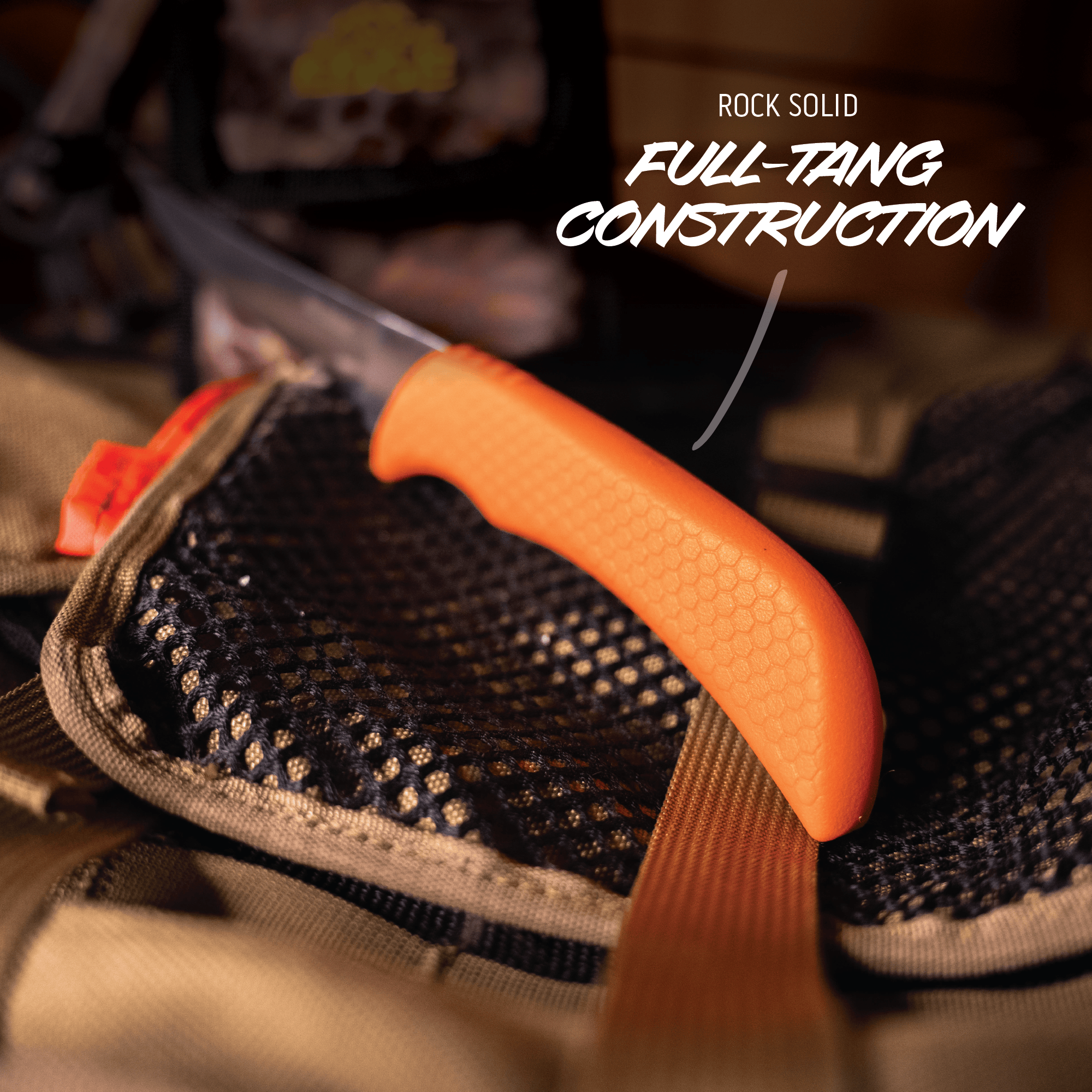 Knife with orange handle and textured blade cover, labeled 'Rock Solid Full-Tang Construction'.