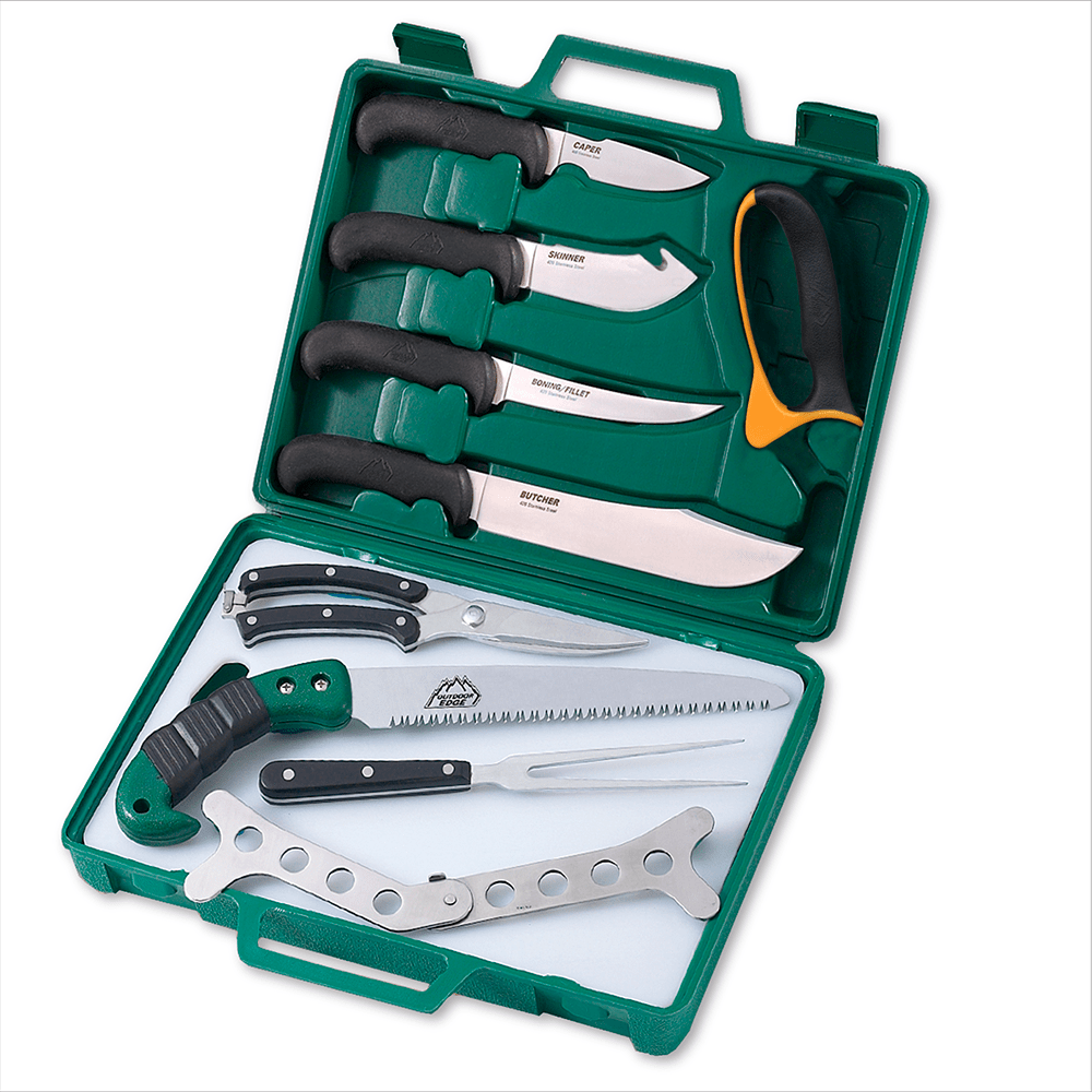 A set of hunting and processing tools with various blades and a saw, displayed in a green hardside carry case.