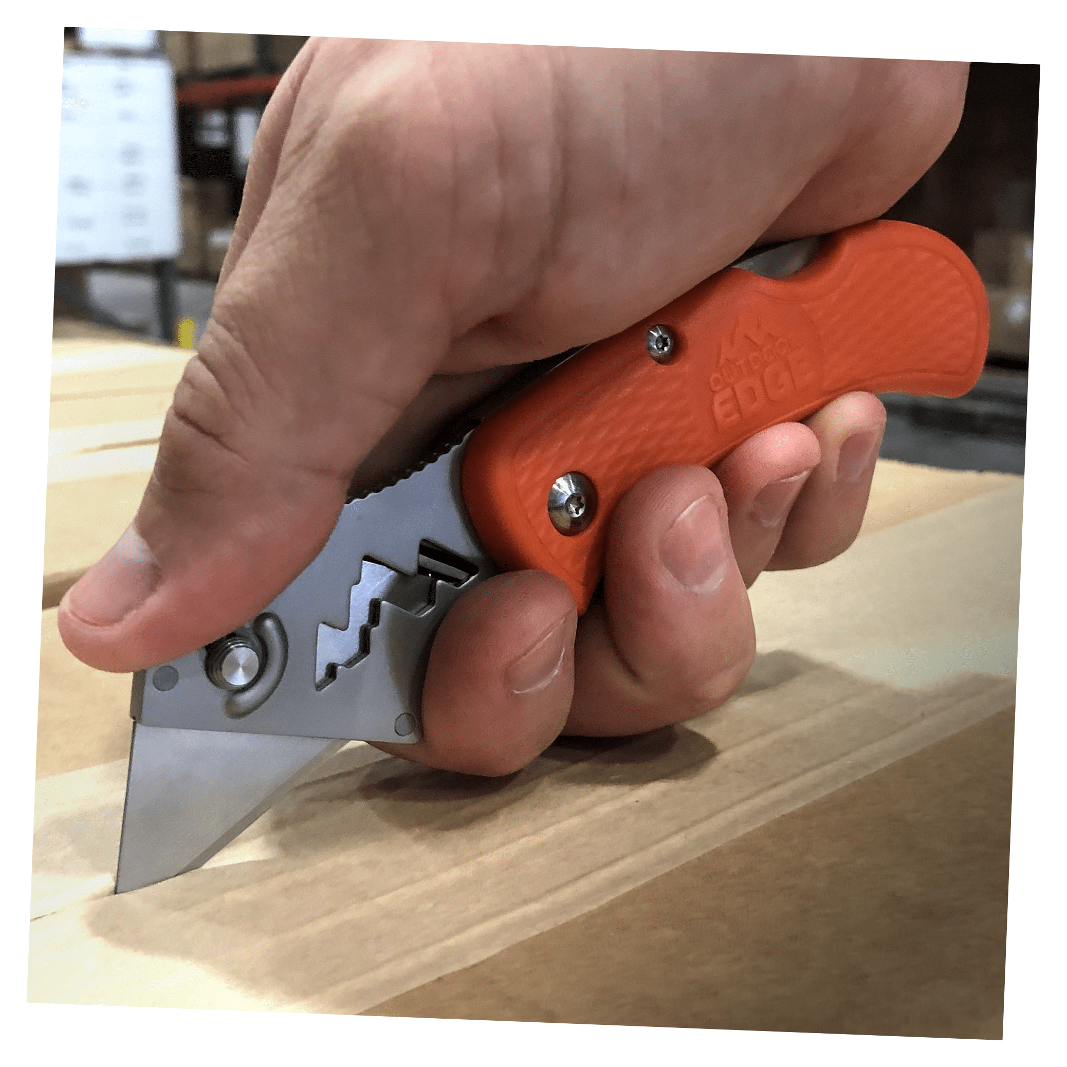 Outdoor Edge Orange B.O.A. (Box Opening Assistant) Utility knife cutting cardboard