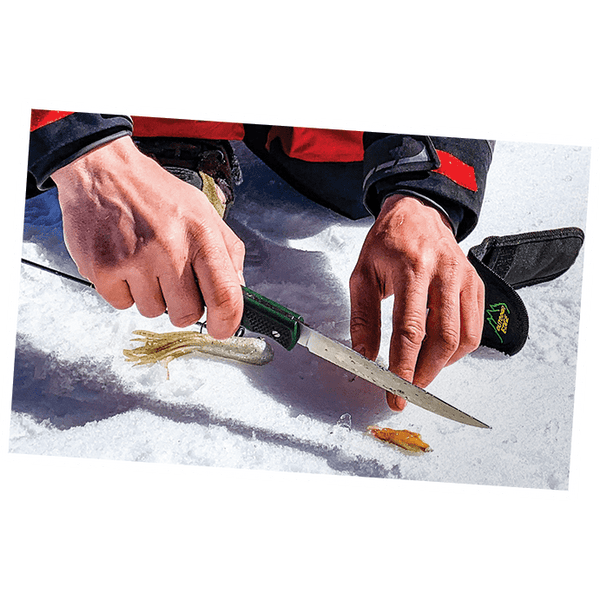 Outdoor Edge Fish and Bone Fillet Knife showing filleting fish on ice