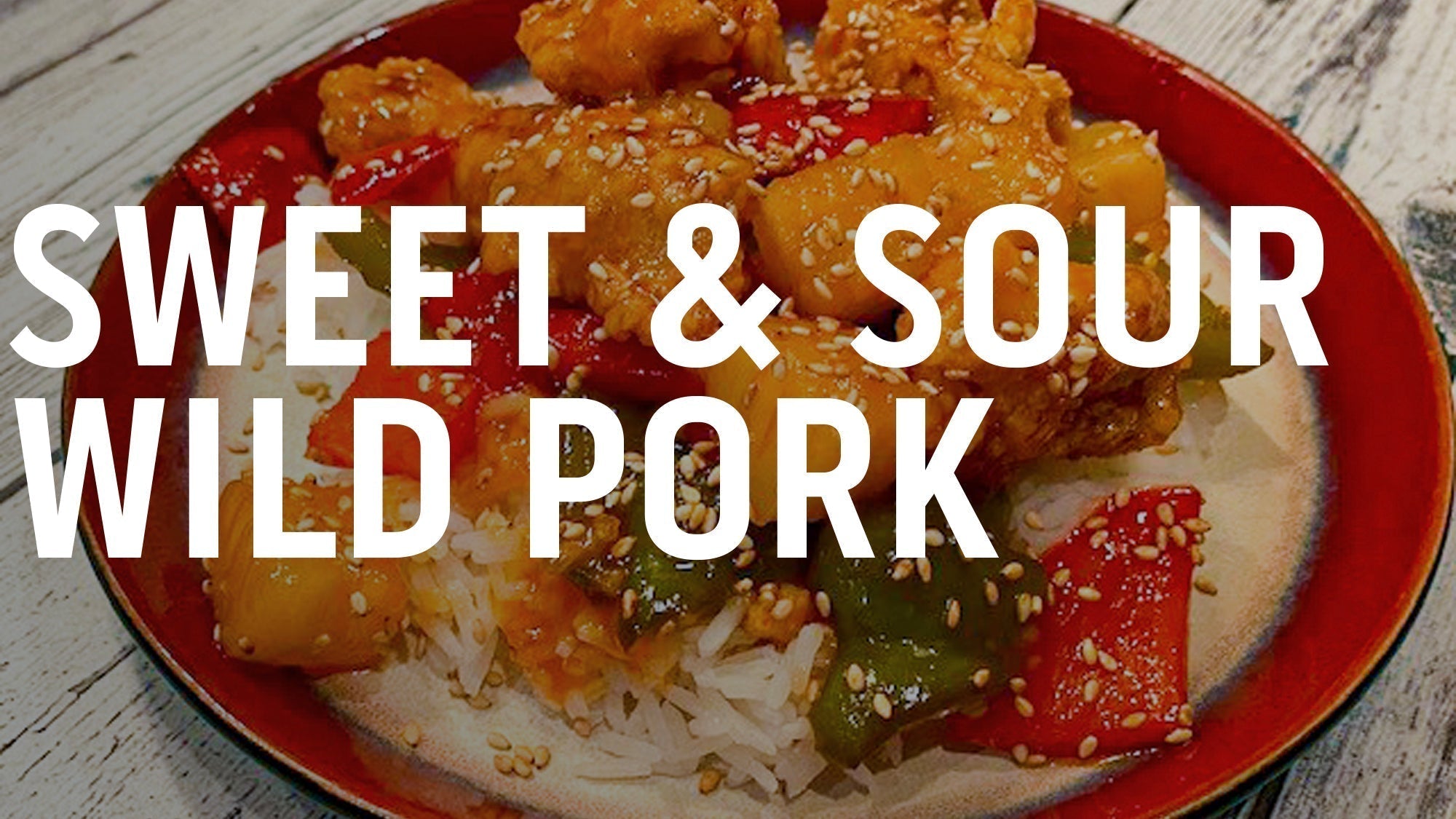  A plate of sweet and sour wild pork with rice and vegetables