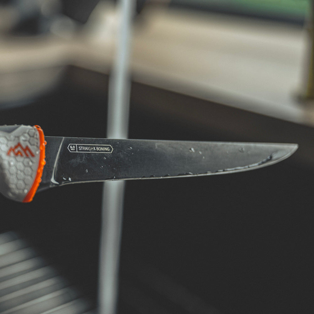 Knife with a textured handle on a blurred background