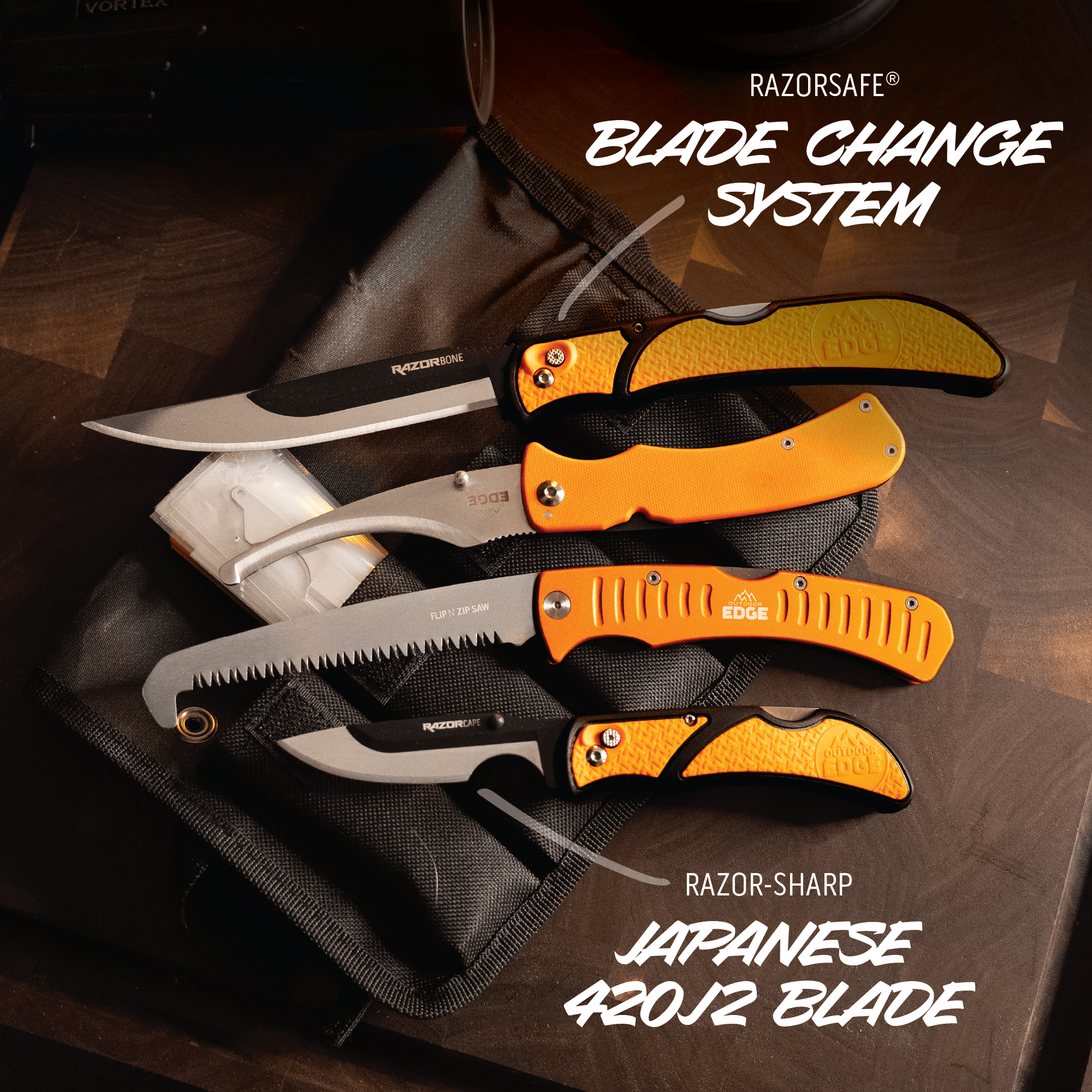 Collection of Razorsafe knives with orange handles on a dark surface