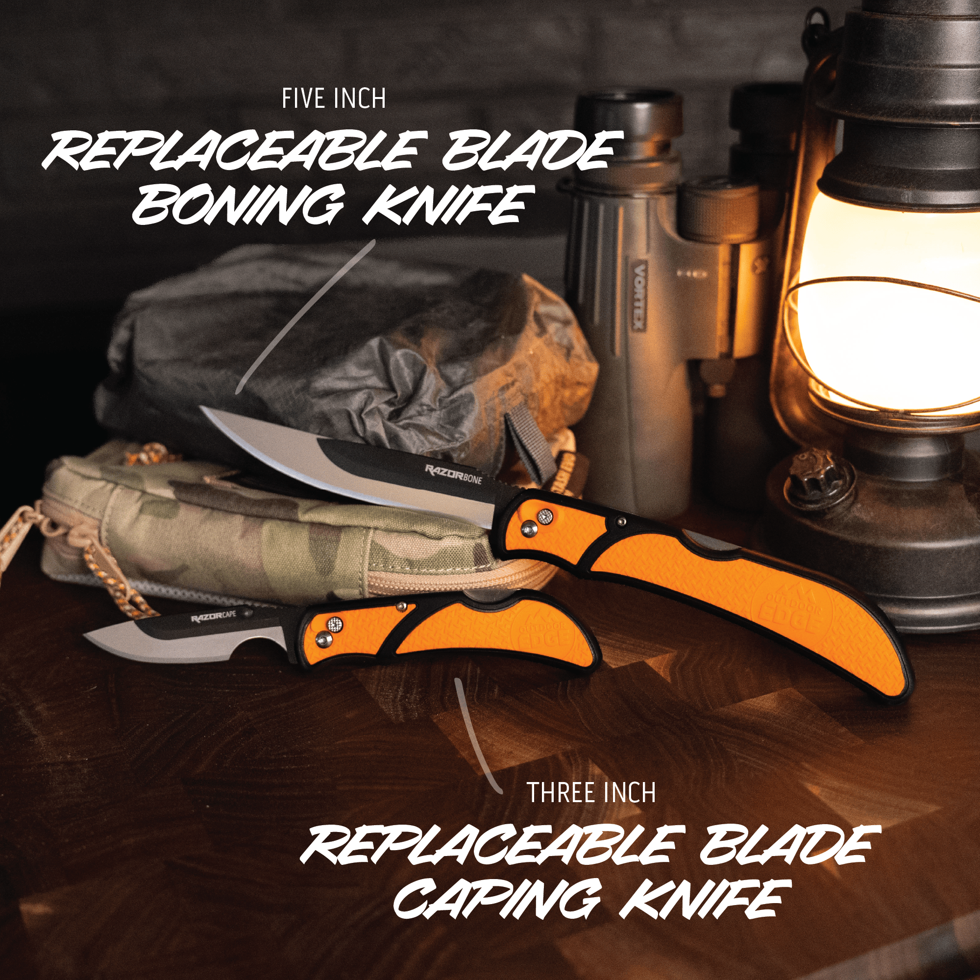 Two knives with different blade lengths on a wooden surface, surrounded by camping gear.