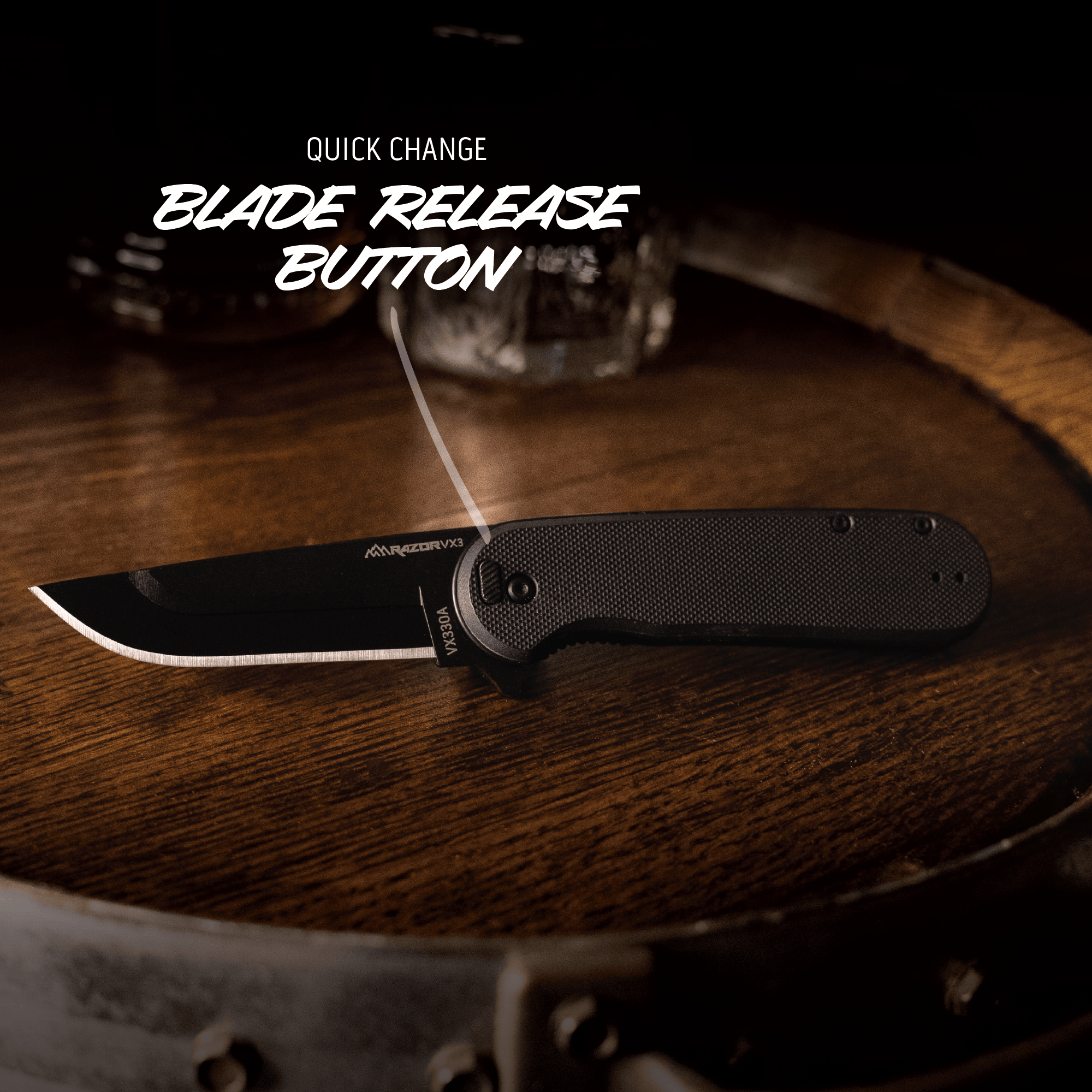Black folding knife with blade release button on a wooden surface