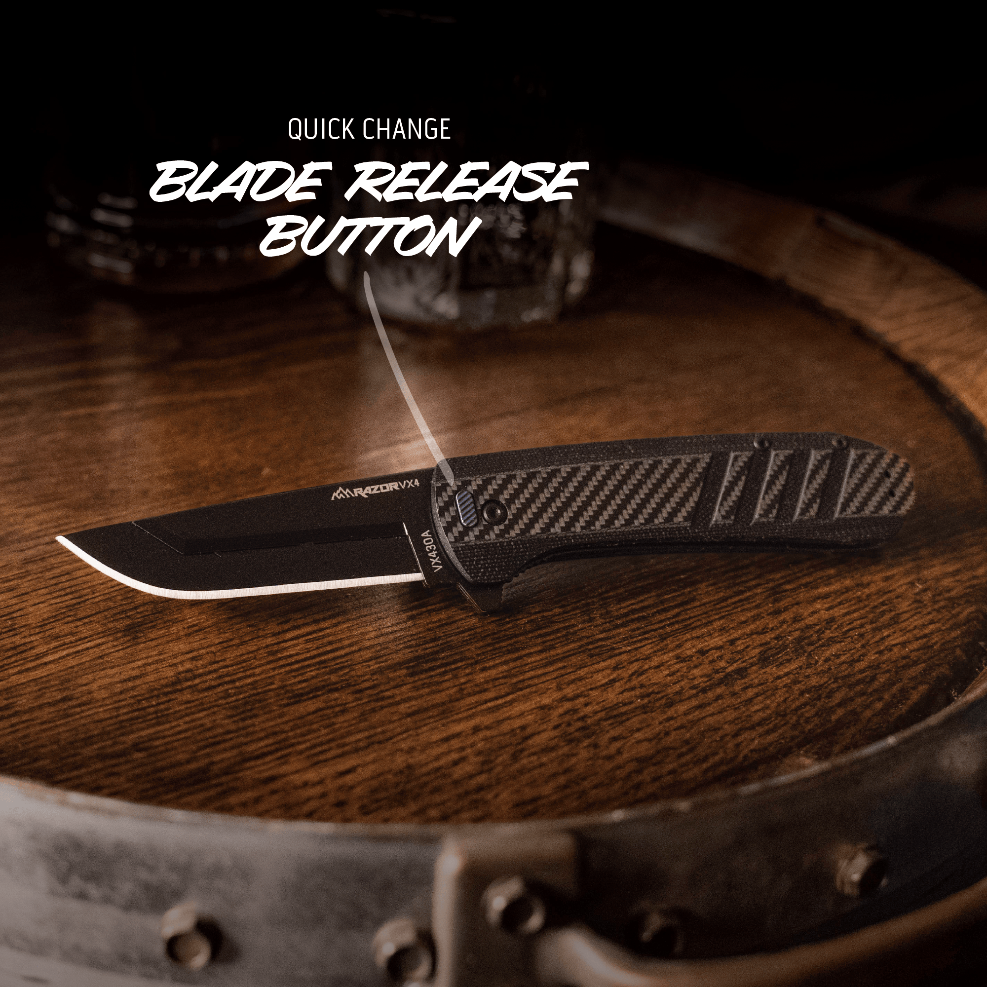 Folding knife with quick change blade release button on a wooden surface