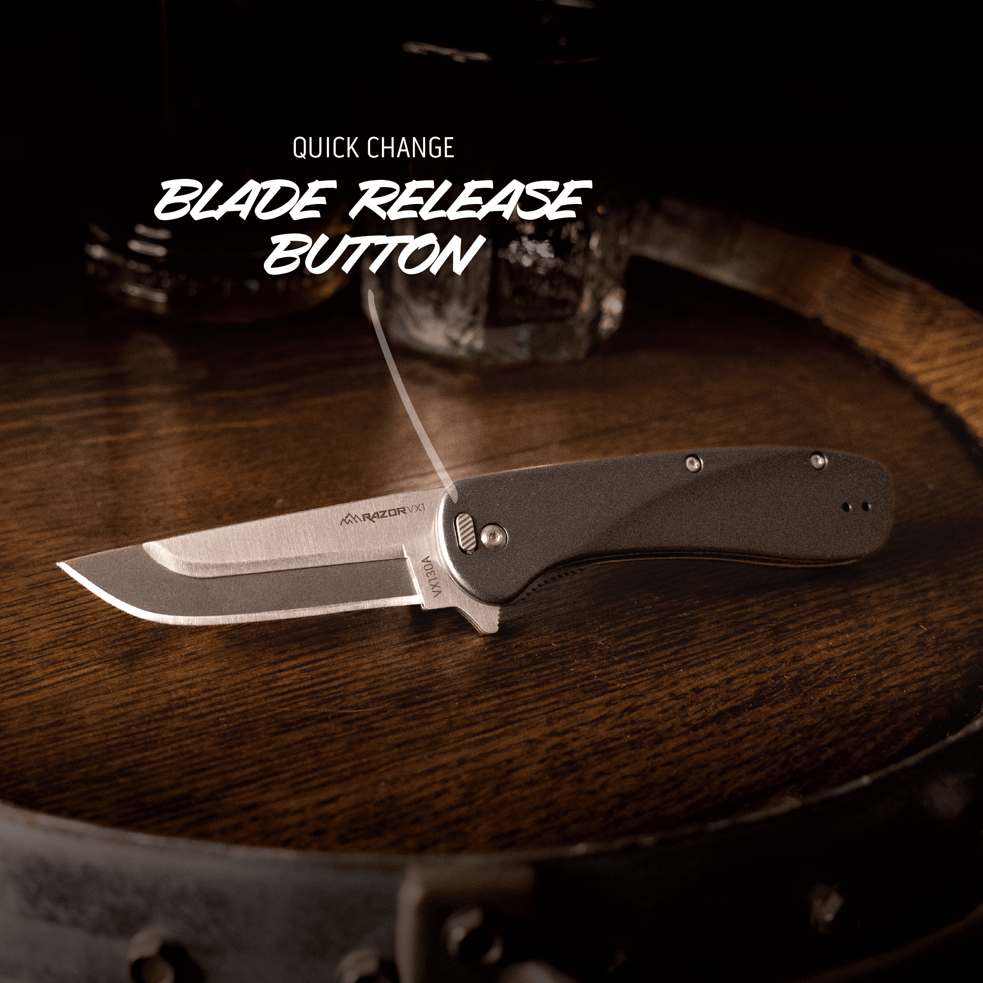 Folding knife with quick change blade release button on a wooden surface