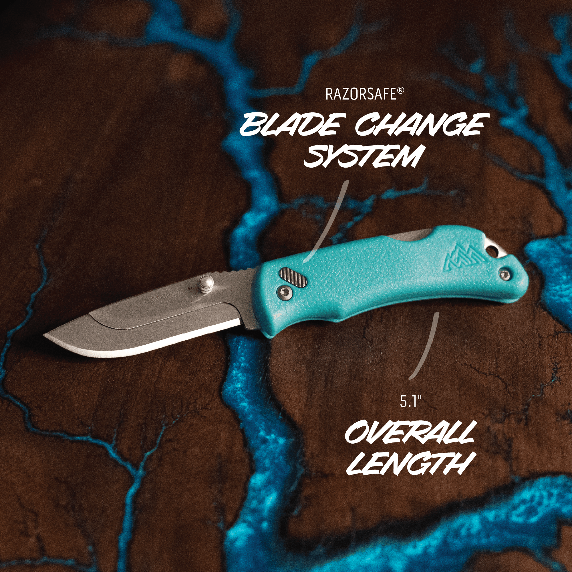 Turquoise pocket knife with blade change system on a textured brown and blue background