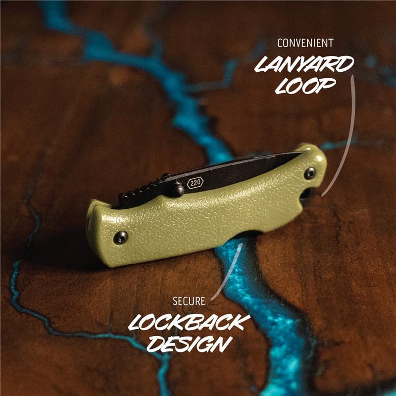 Green pocket knife with lanyard loop on a textured brown background