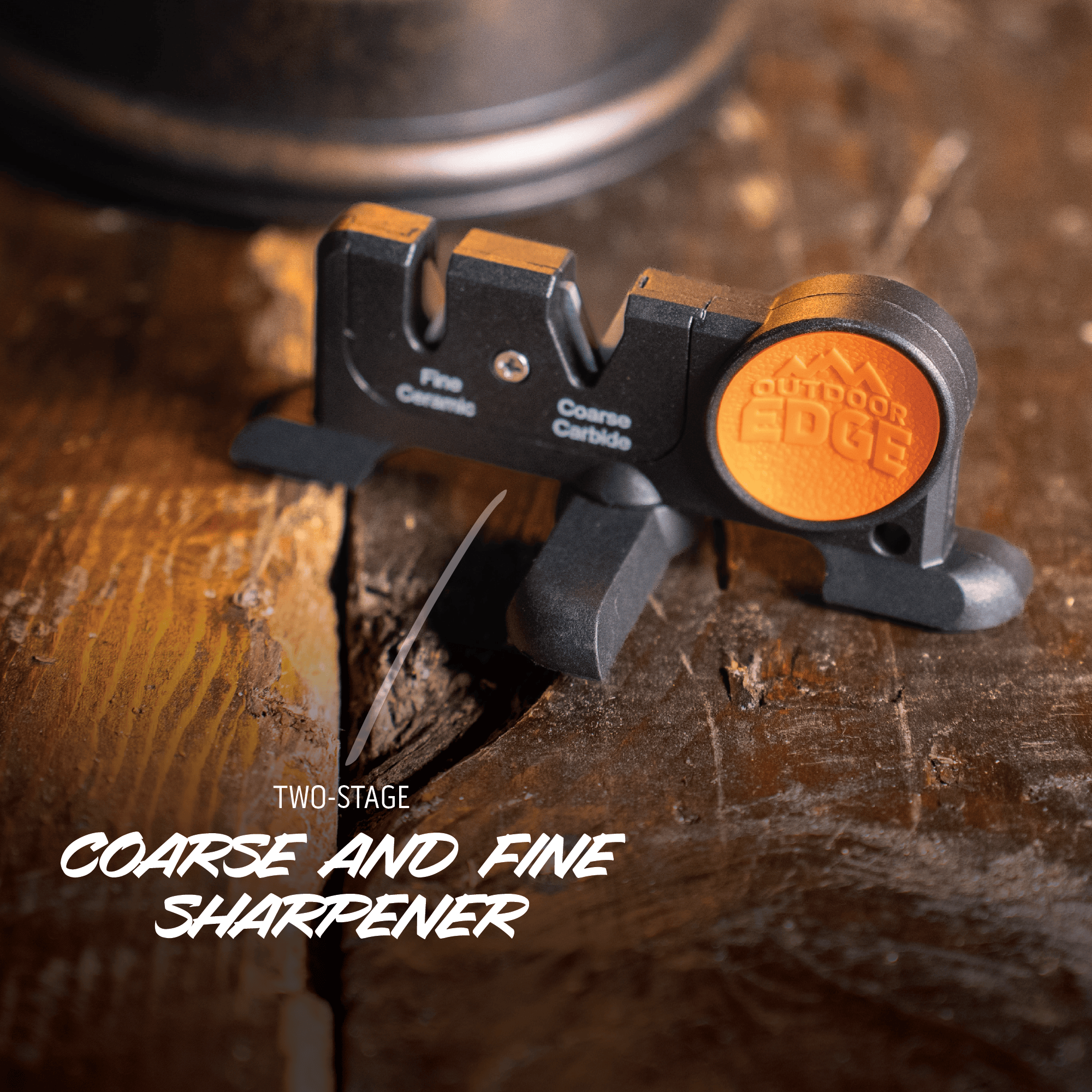Two-stage coarse and fine sharpener on a wooden surface with 'Outdoor Edge' branding.