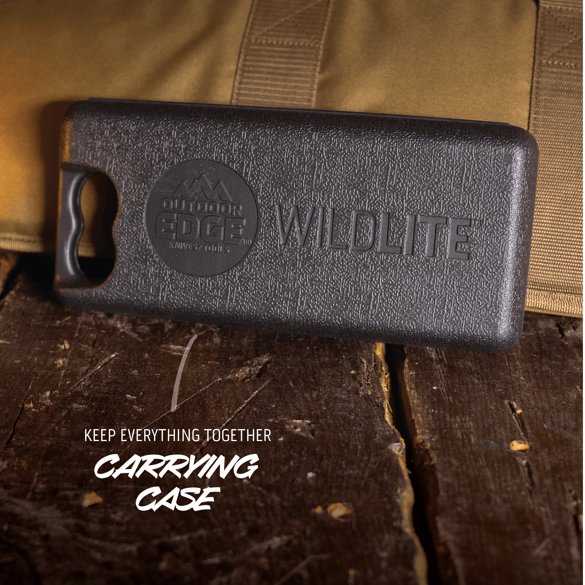 Black carrying case with 'Outdoor Edge' logo on a wooden surface