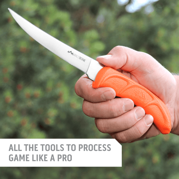 Outdoor Edge WildLite Field and Home Processing knife Set in the woods with fillet knife